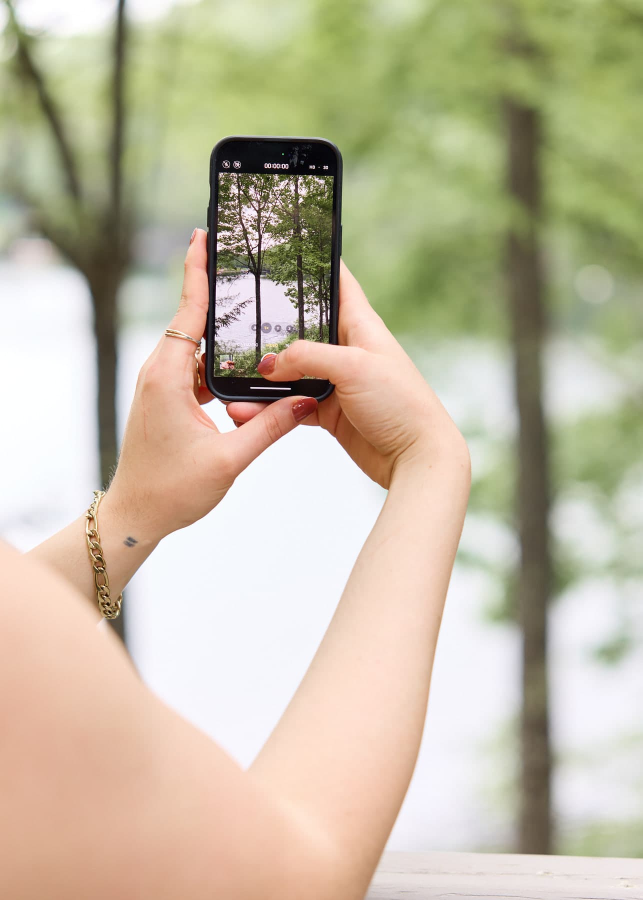 Capturing original wellness content beside trees and water