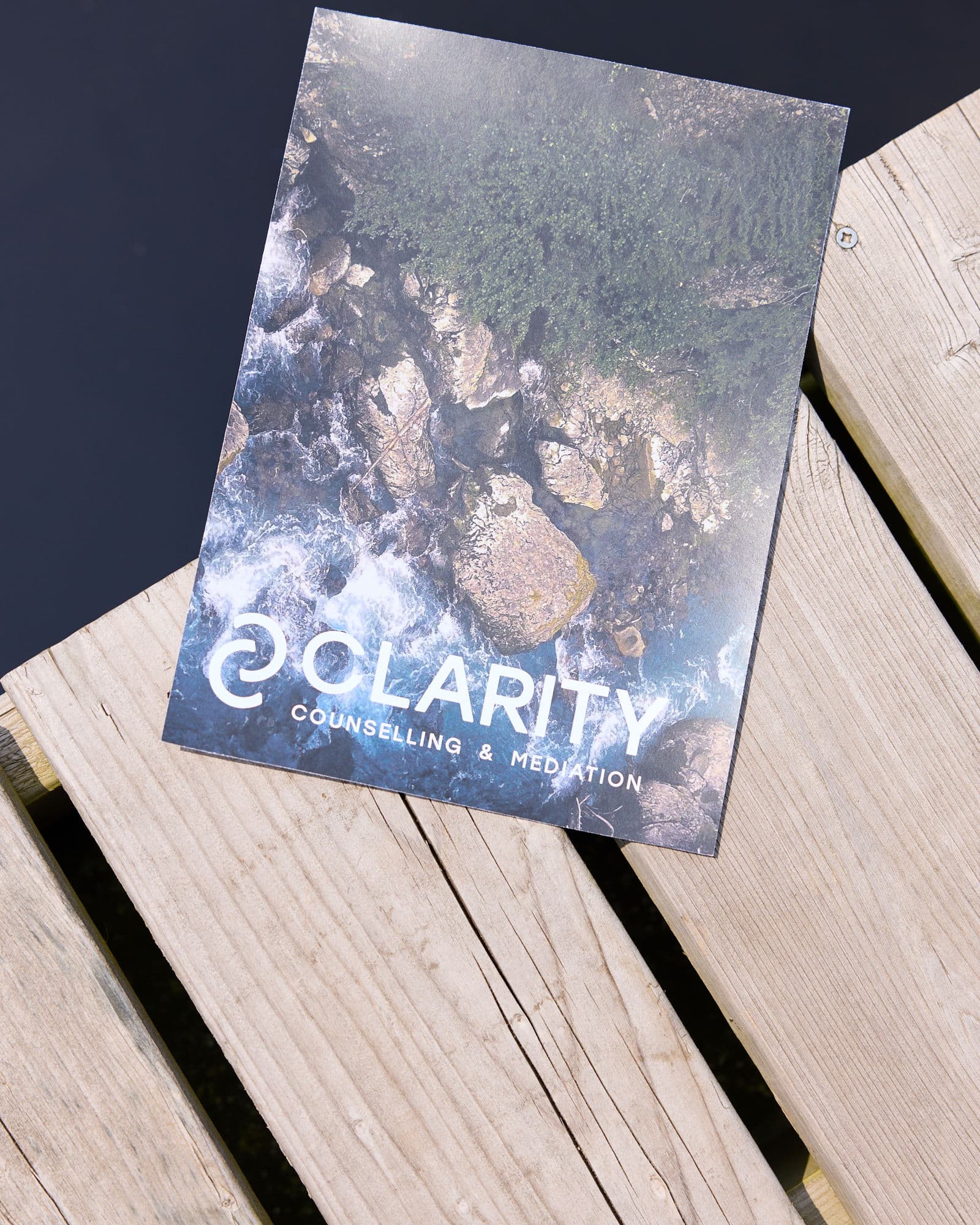 Clarity Counselling and Mediation identity over an aerial river landscape